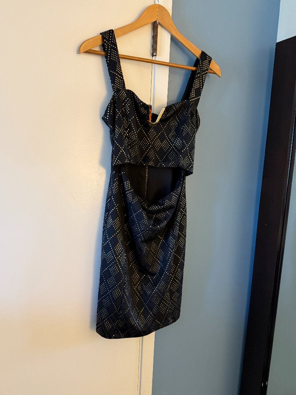 Nikibiki black peekaboo mini dress with gold studs